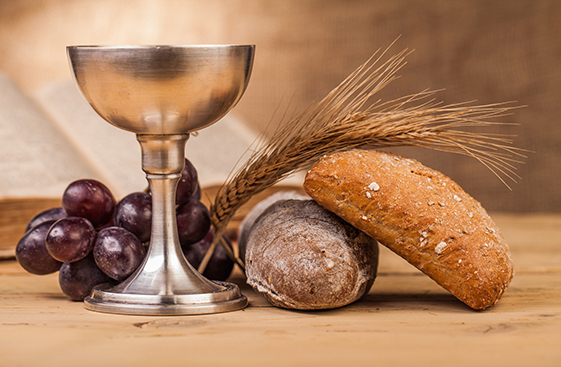 Communion chalice, bread, wheat